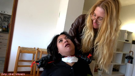 asian woman strangled by a blonde in leather outfit and leather gloves